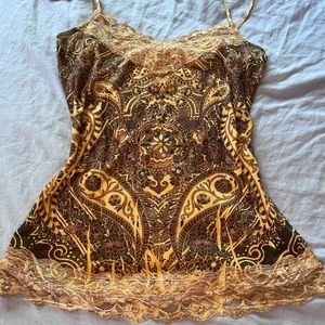 Size medium tank top. Has little rhinestones in the middle